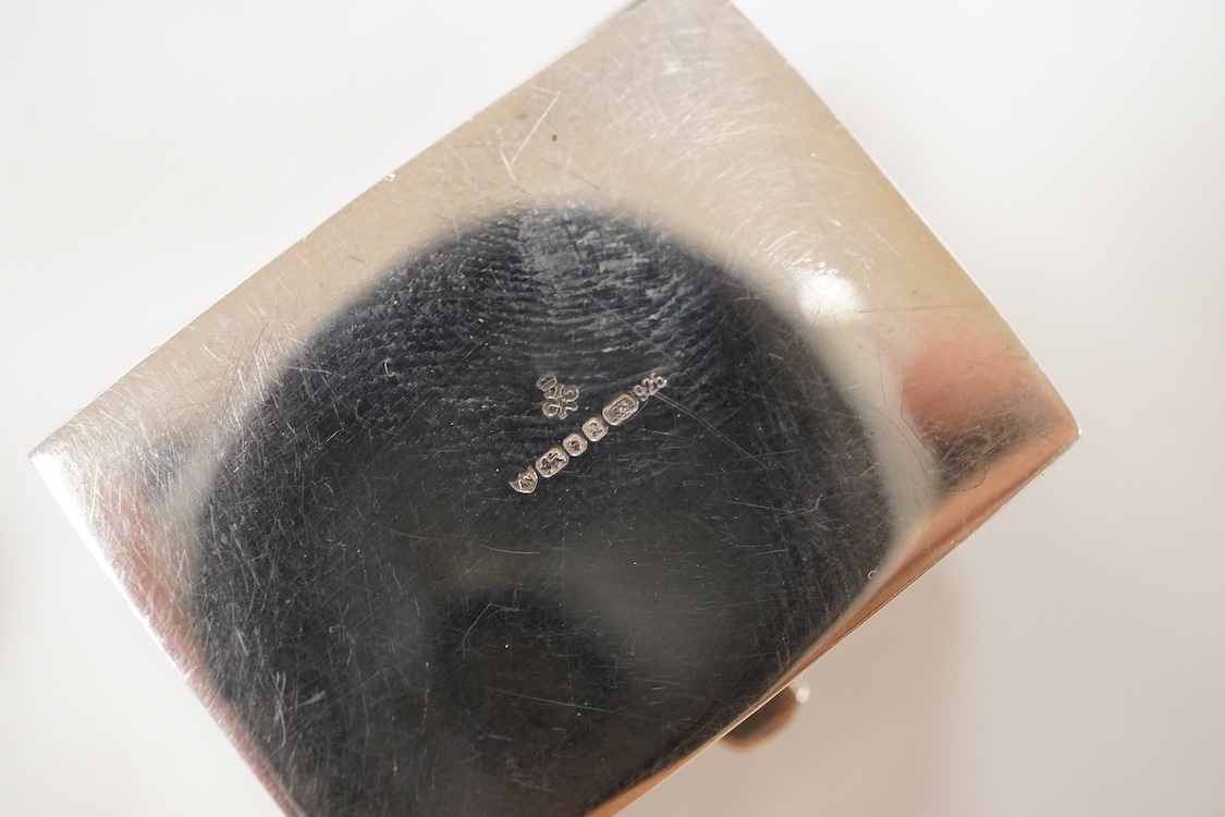 A Japanese white metal and polychrome enamel vesta case, decorated with flowers and butterfly, 56mm, together with a 19th century Russian 84 zolotnik and niello snuff box(tired), a modern silver pill box and a silver mou